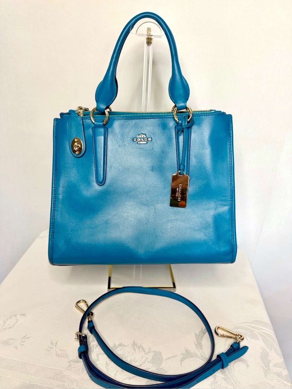 Coach Crosby Carryall Handbag in a vibrant teal/blue leather finish.
